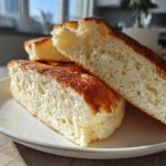 Close-up of the fluffy, airy interior texture of cut Greek yogurt pancakes.