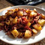 A plate of crispy Air Fryer Corned Beef Hash featuring golden potatoes and shredded corned beef.