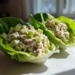 Two fresh tuna salad lettuce wraps topped with chopped celery, showing the Easiest Way to Eat lunch.